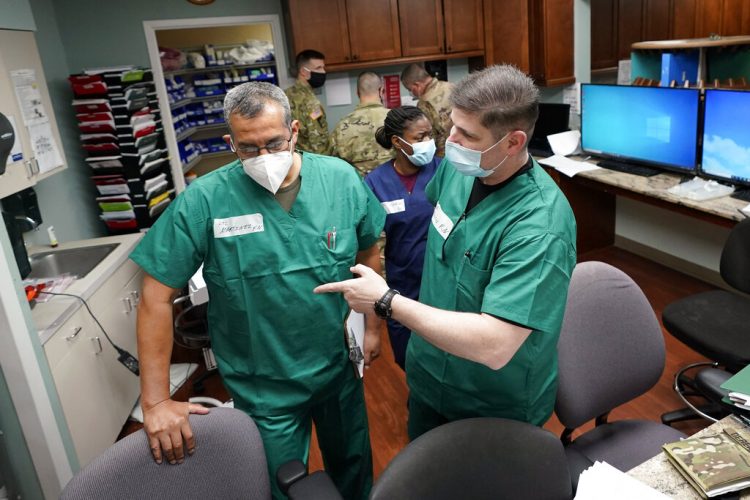 As virus surges in some US states, emergency rooms swamped